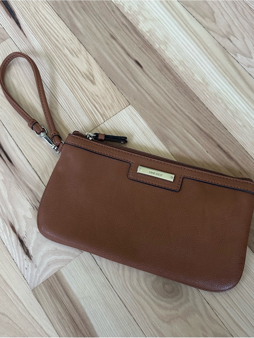 Great condition! Nine West Tan Pebbled Leather Wristlet with Gold Plaque